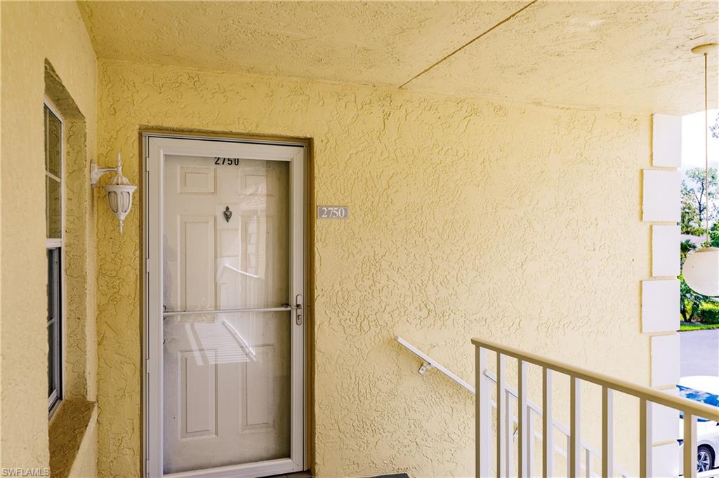 2750 Kings Lake Boulevard, Unit 204 Naples, FL 34112 - Photo 5 of 31 a bathroom with a shower