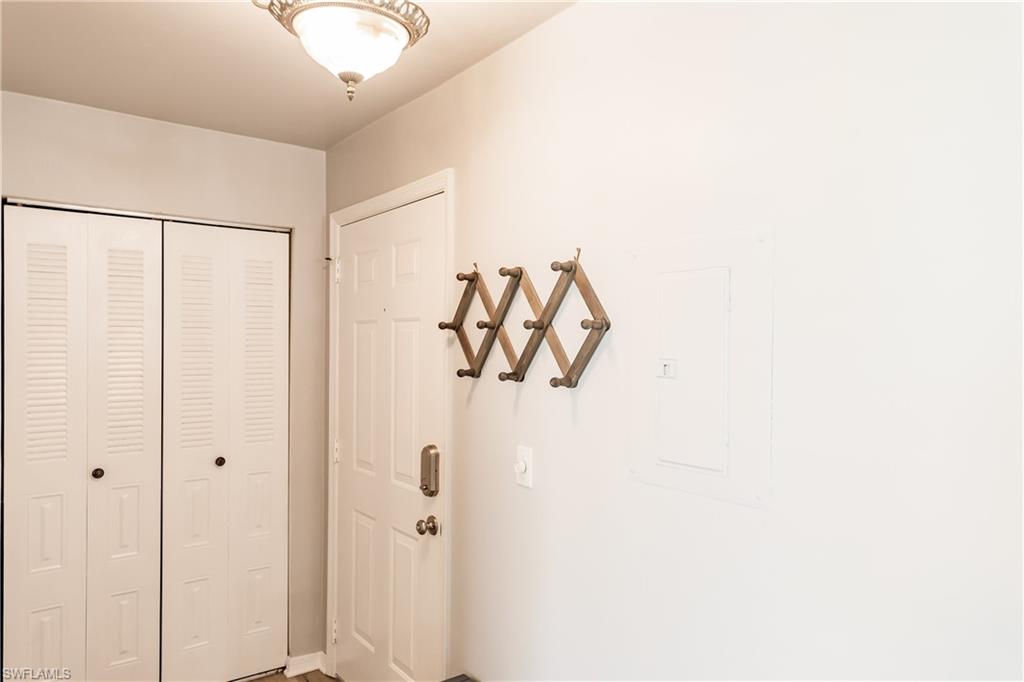 2750 Kings Lake Boulevard, Unit 204 Naples, FL 34112 - Photo 6 of 31 a bathroom with a shower and a mirror