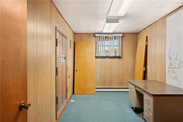 a view of an empty room and a window