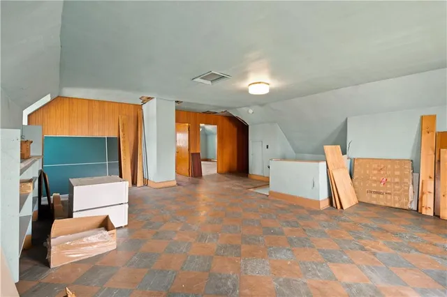 a view of an entryway with wooden floor and windows
