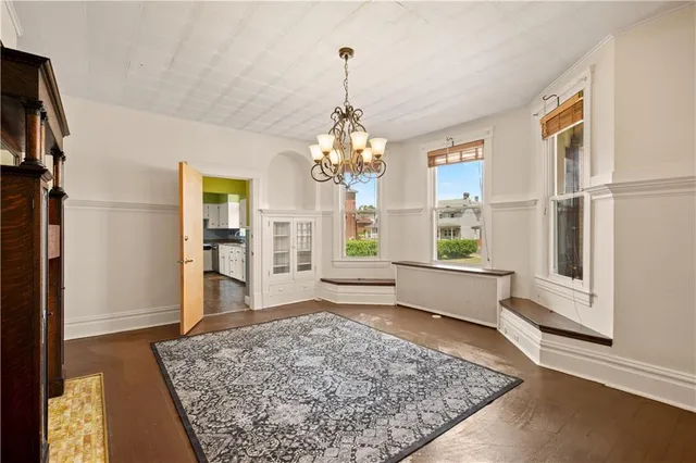 a living room with a couch and a rug