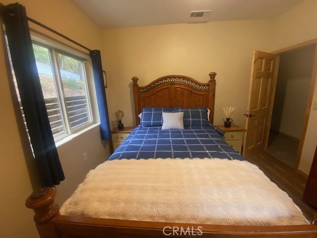 5935 Aluffo Road Paso Robles, CA 93446 - Photo 34 of 43 a bed sitting in a bedroom next to a window