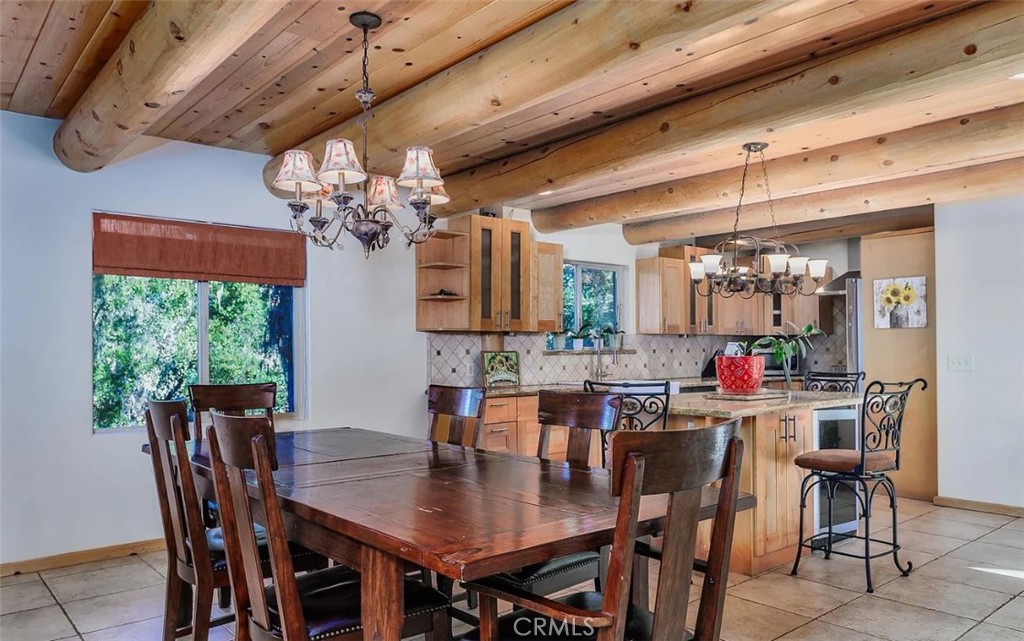 5935 Aluffo Road Paso Robles, CA 93446 - Photo 8 of 43 a view of a dining room with furniture a chandelier and large window