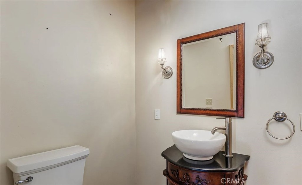 5935 Aluffo Road Paso Robles, CA 93446 - Photo 10 of 43 a bathroom with a toilet a sink and mirror