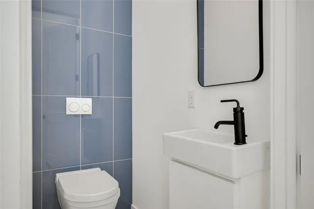 a bathroom with a toilet and a sink