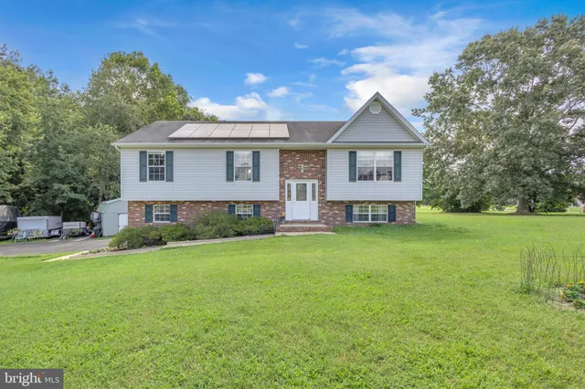 a view of a house with a back yard