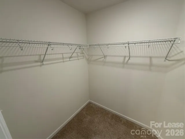 a bathroom with a glass door shower and a sink