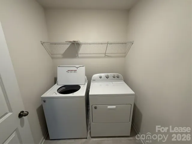 a bathroom with a granite countertop bathtub shower sink vanity and toilet