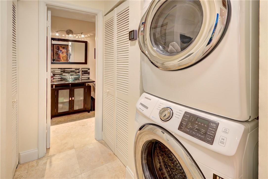 3130 Millwood Terrace, Unit M210 Boca Raton, FL 33431 - Photo 11 of 23 a view of washer and dryer