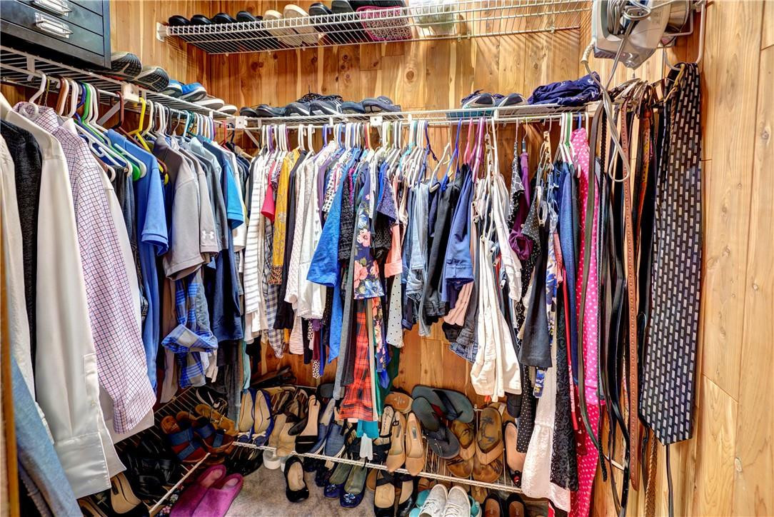 3130 Millwood Terrace, Unit M210 Boca Raton, FL 33431 - Photo 19 of 23 a view of walk in closet with clothes