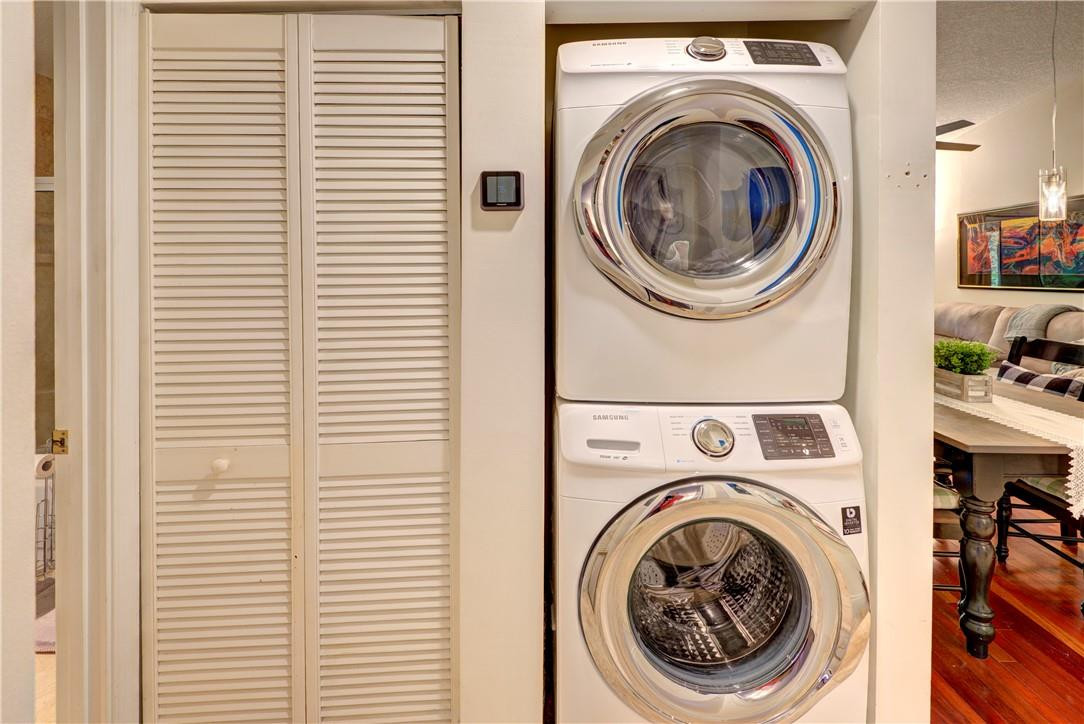 3130 Millwood Terrace, Unit M210 Boca Raton, FL 33431 - Photo 21 of 23 a utility room with dryer and washer
