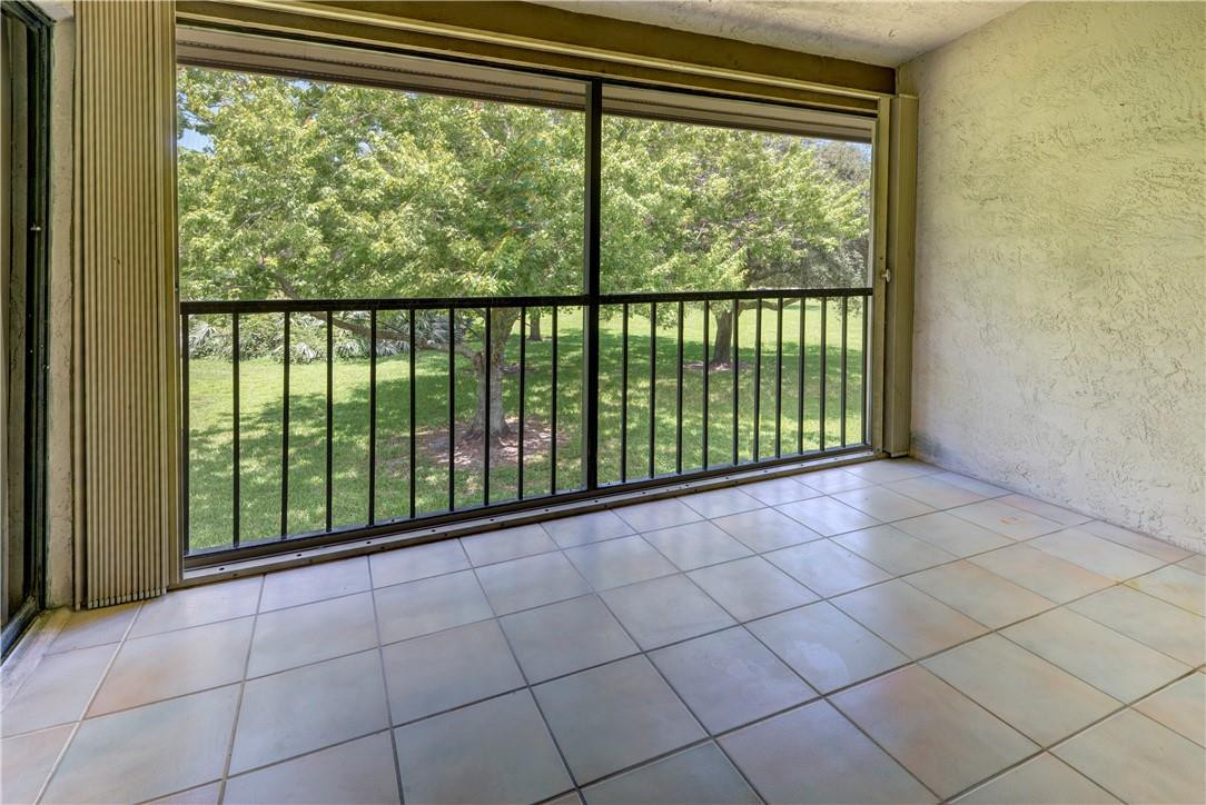 3130 Millwood Terrace, Unit M210 Boca Raton, FL 33431 - Photo 23 of 23 a view of a room that has a large window