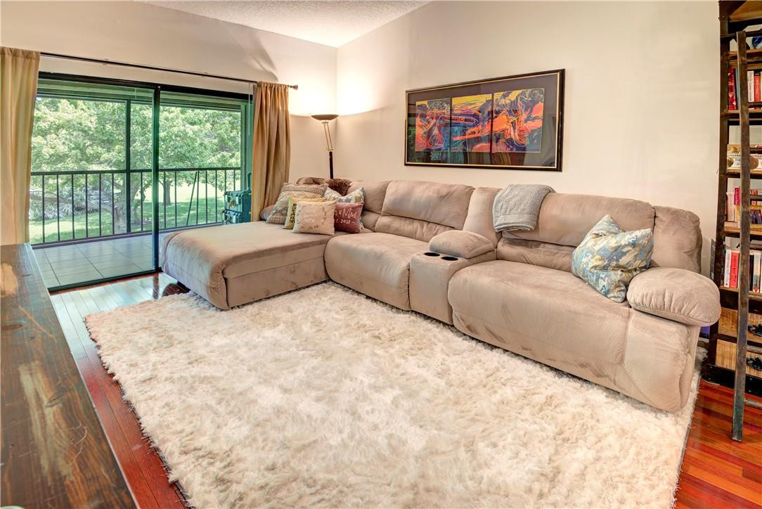 3130 Millwood Terrace, Unit M210 Boca Raton, FL 33431 - Photo 8 of 23 a living room with furniture large window and couch