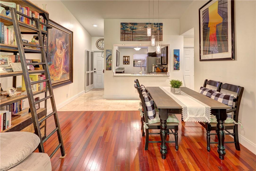 3130 Millwood Terrace, Unit M210 Boca Raton, FL 33431 - Photo 9 of 23 a view of a dining room with furniture and wooden floor