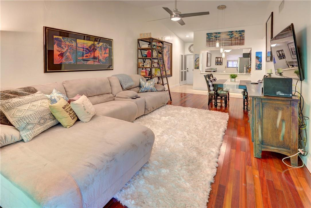 3130 Millwood Terrace, Unit M210 Boca Raton, FL 33431 - Photo 10 of 23 a living room with furniture and a flat screen tv