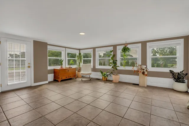 a view of a livingroom with furniture and a flat screen tv