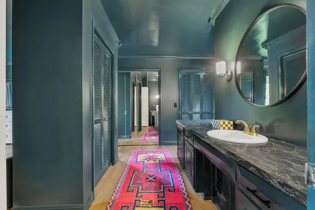 a view of kitchen cabinets and chandelier