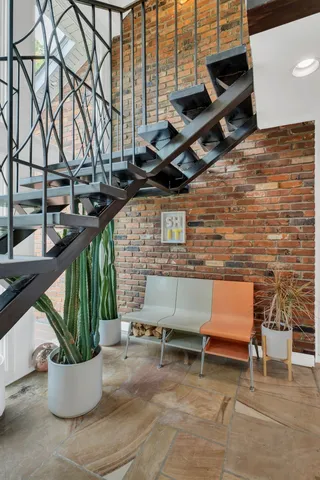 a view of a patio with a table and chairs
