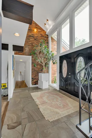 a view of a livingroom with furniture and a fireplace