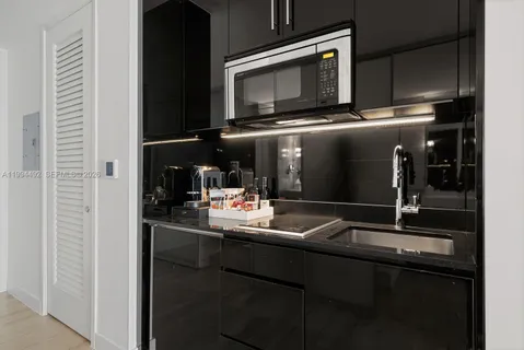 a kitchen with a sink and an oven