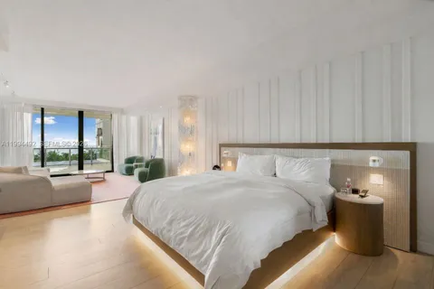 a large white bed in a white room