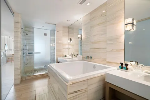 a view of a bathroom sink and a bathtub