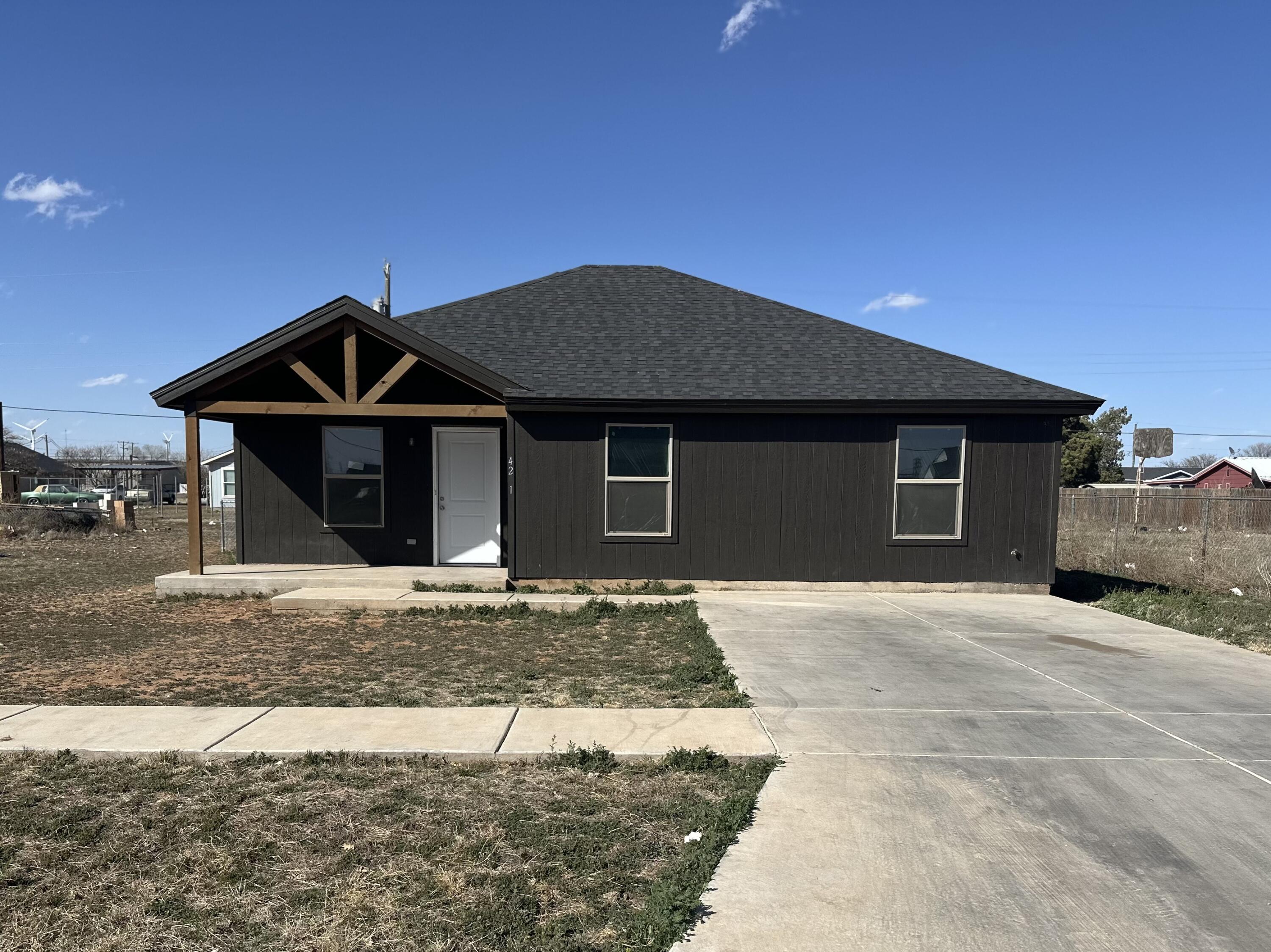 4202 East 64th Street Lubbock, TX 79403 - Photo 1 of 19 a front view of a house with a garden