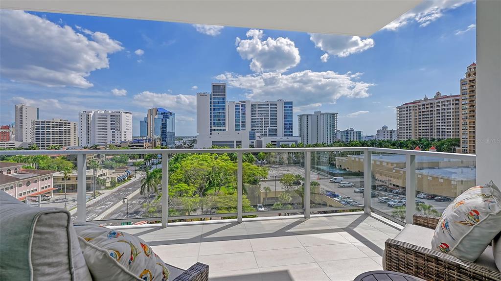 301 Quay Commons, Unit 606 Sarasota, FL 34236 - Photo 17 of 36 a view of a terrace with sitting area