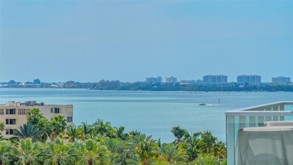 301 Quay Commons, Unit 606 Sarasota, FL 34236 - Photo 24 of 36 a view of a lake with a big yard