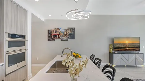 a kitchen with stainless steel appliances a refrigerator and a sink