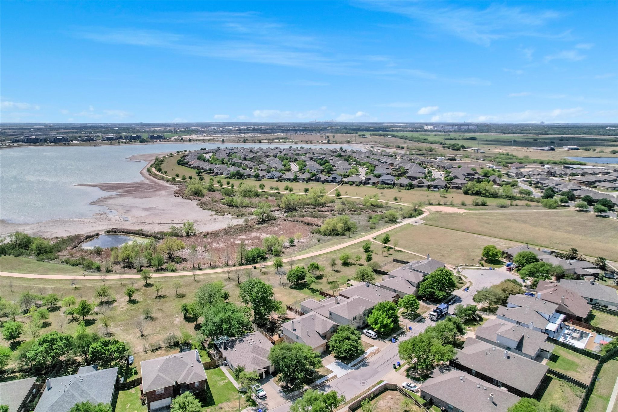 4029 Lake Edge Way Pflugerville, TX 78660 - Photo 30 of 35 Aerial perspective of suburban area featuring a nearby body of water