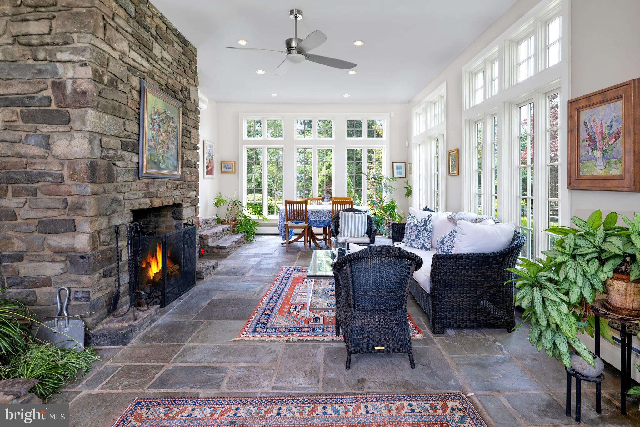 122 Bedens Brook Road Skillman, NJ 08558 - Photo 22 of 49 a living room with furniture large window and a fireplace