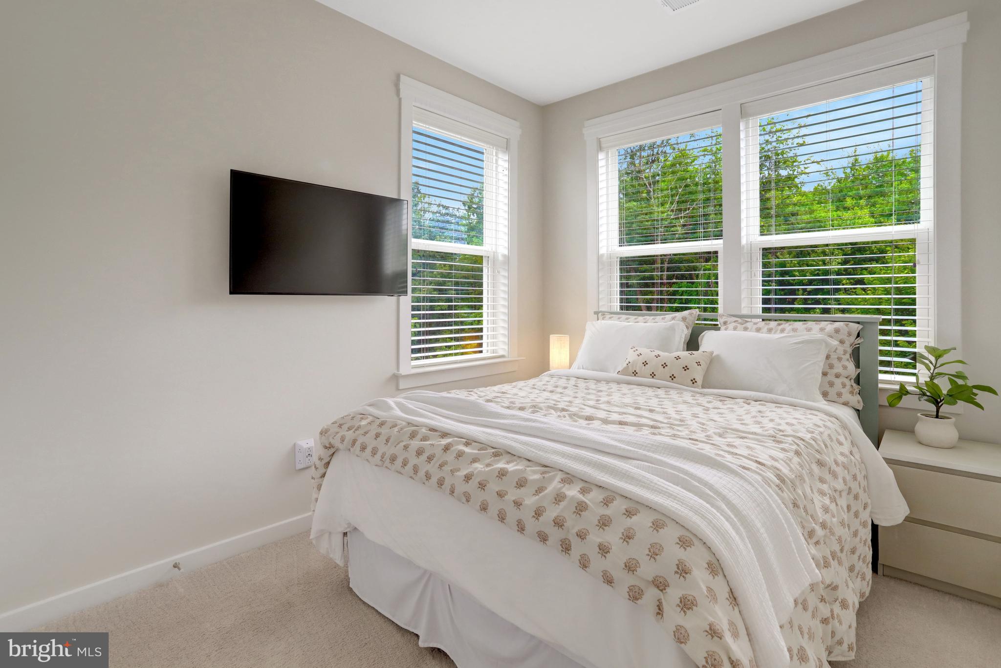 9180 Snowden Ashford Road Lorton, VA 22079 - Photo 16 of 28 a bedroom with a bed and a flat screen tv