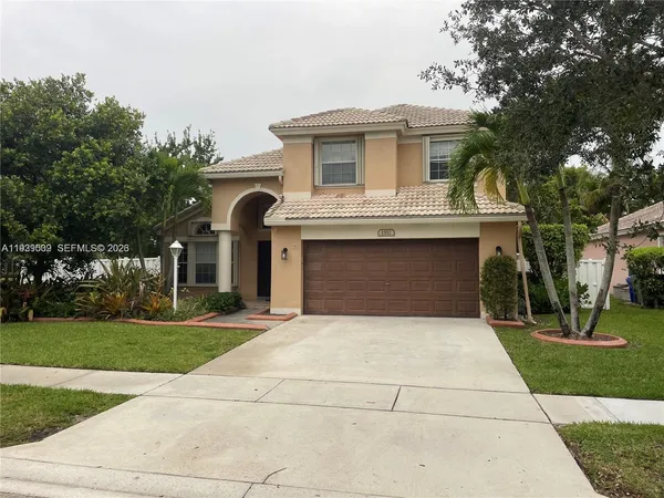a front view of a house with yard