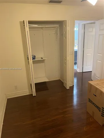 a living room with furniture and a mirror