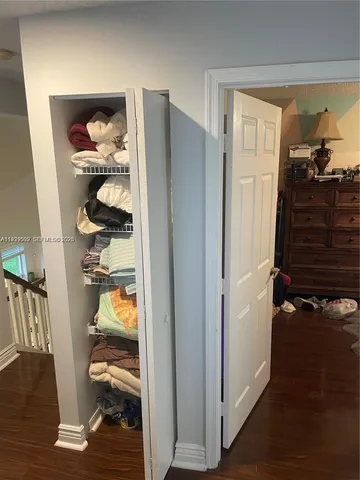 a room with a bed and large window