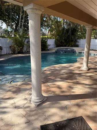 a view of a swimming pool with a sitting area