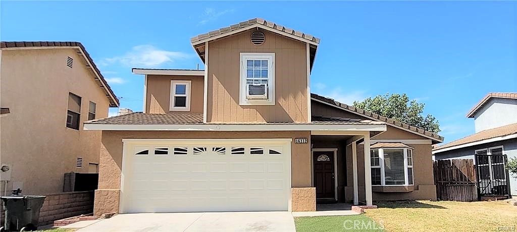 a front view of a house with yard