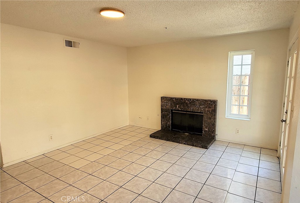 16332 Trelaney Road Fontana, CA 92337 - Photo 4 of 8 a view of an empty room and window
