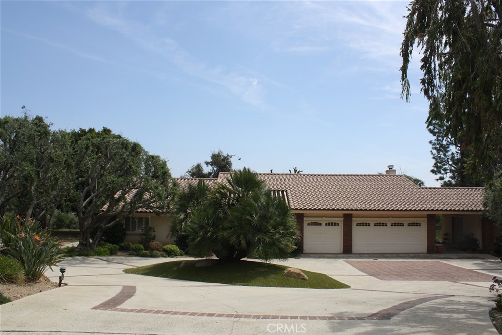 9865 Cinch Ring Lane Rancho Cucamonga, CA 91737 - Photo 1 of 1 a view of a house with a yard and tree