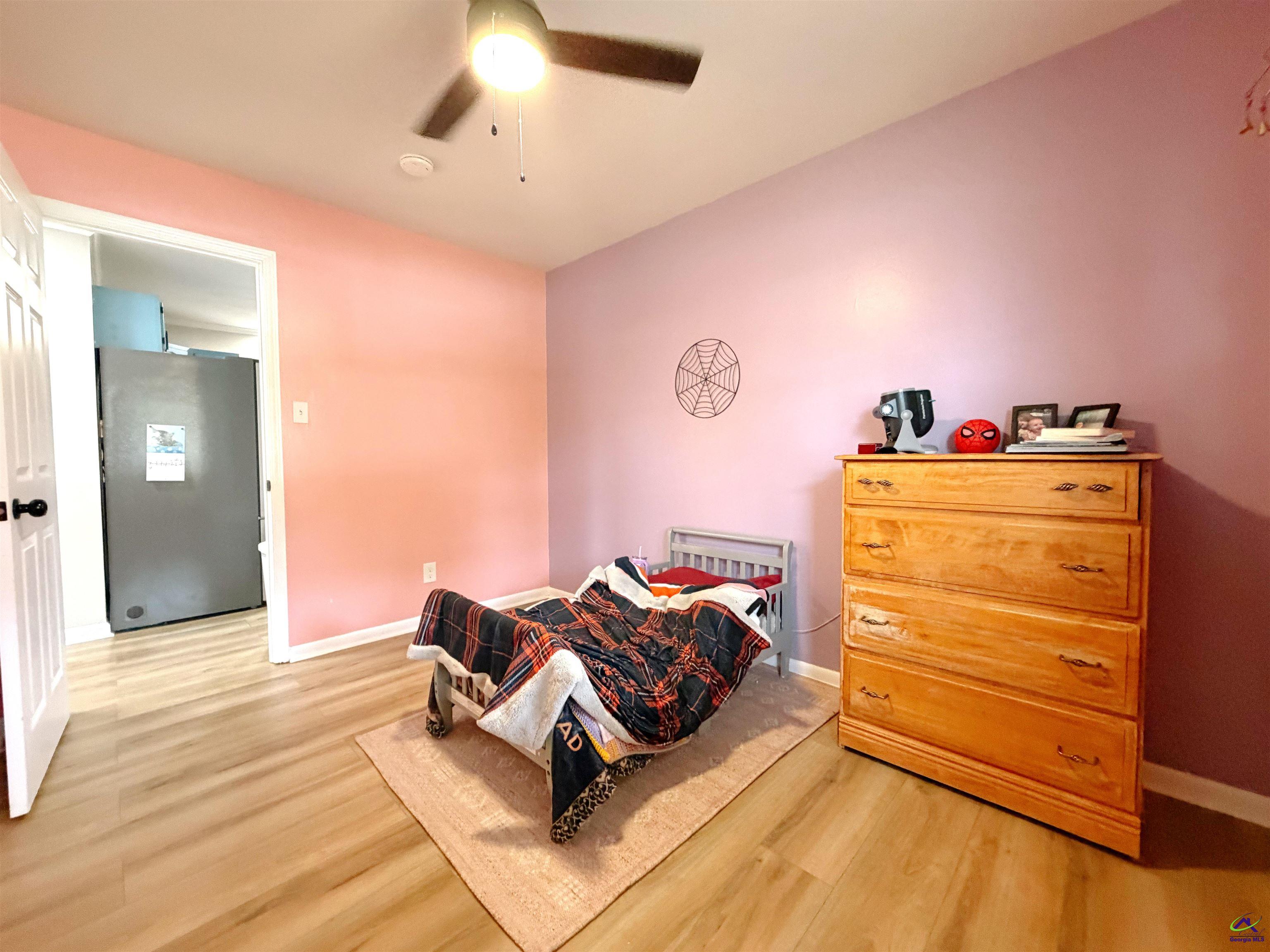 108 Weaver Road Warner Robins, GA 31093 - Photo 16 of 26 a living room with furniture and a dresser