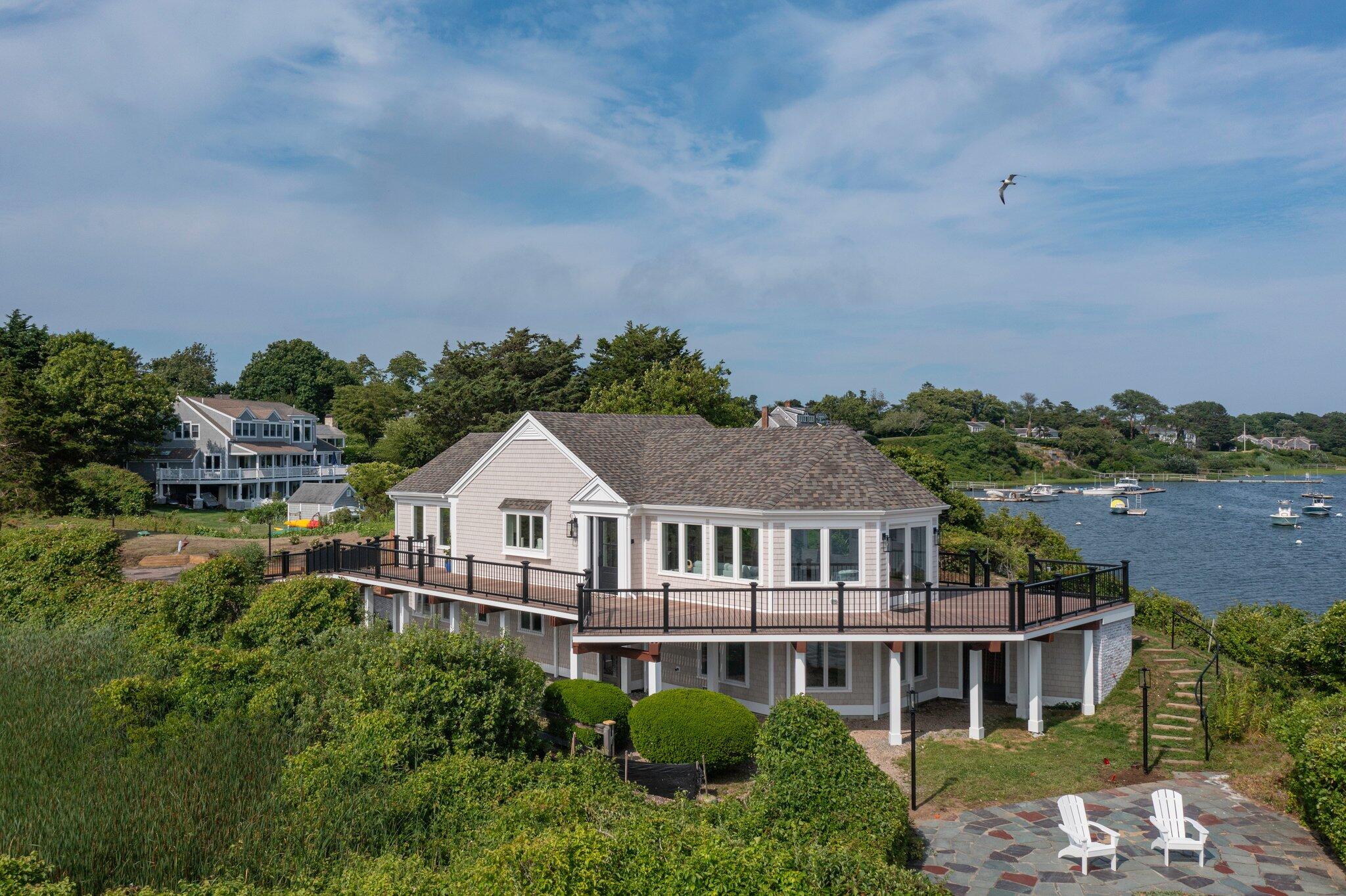 127 Christopher Harding Lane Chatham, MA 02633 - Photo 1 of 43 an aerial view of a house with a yard and balcony