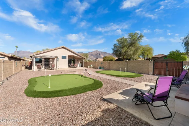 a white and red house with a yard