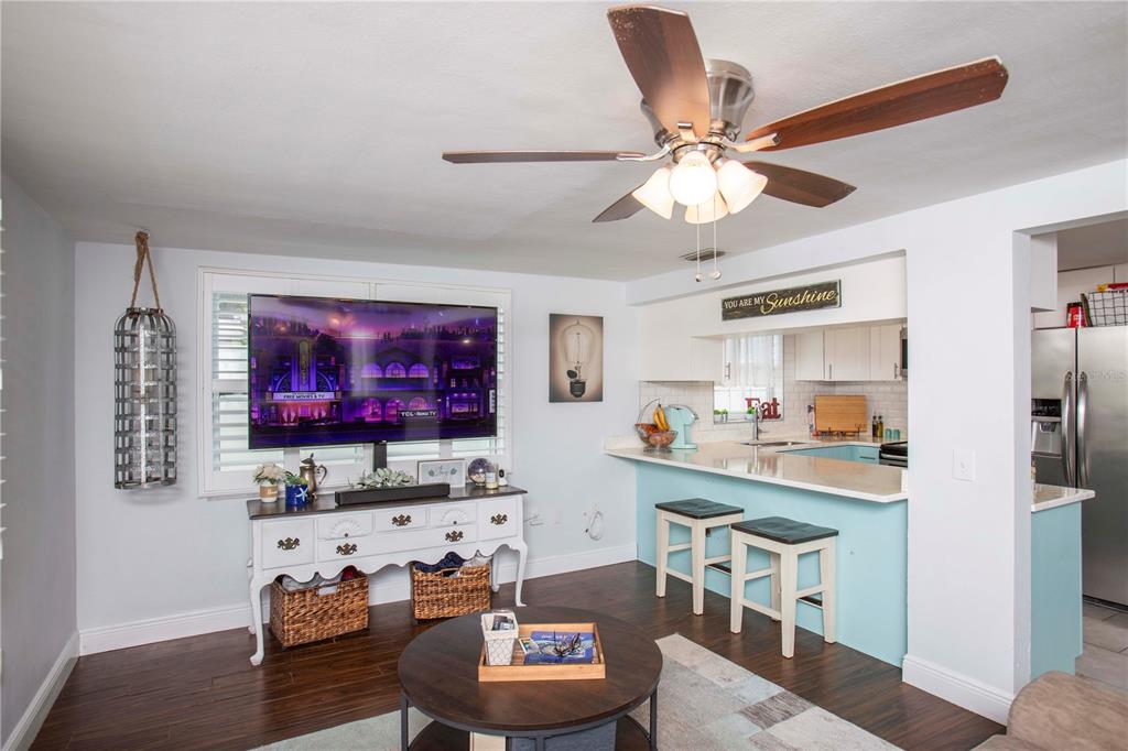 5240 School Road New Port Richey, FL 34653 - Photo 12 of 32 a living room with furniture and a flat screen tv