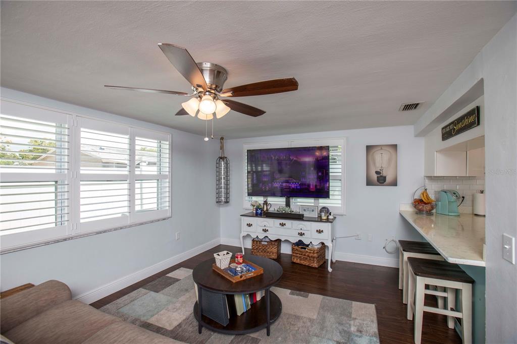 5240 School Road New Port Richey, FL 34653 - Photo 13 of 32 a living room with furniture and a flat screen tv