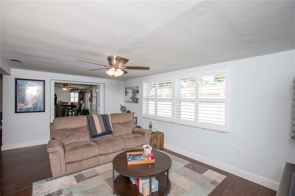 5240 School Road New Port Richey, FL 34653 - Photo 15 of 32 a living room with furniture and a large window