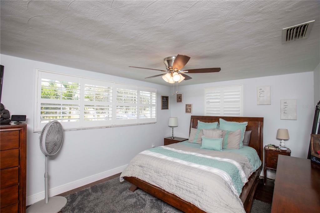 5240 School Road New Port Richey, FL 34653 - Photo 17 of 32 a bedroom with a bed and a window