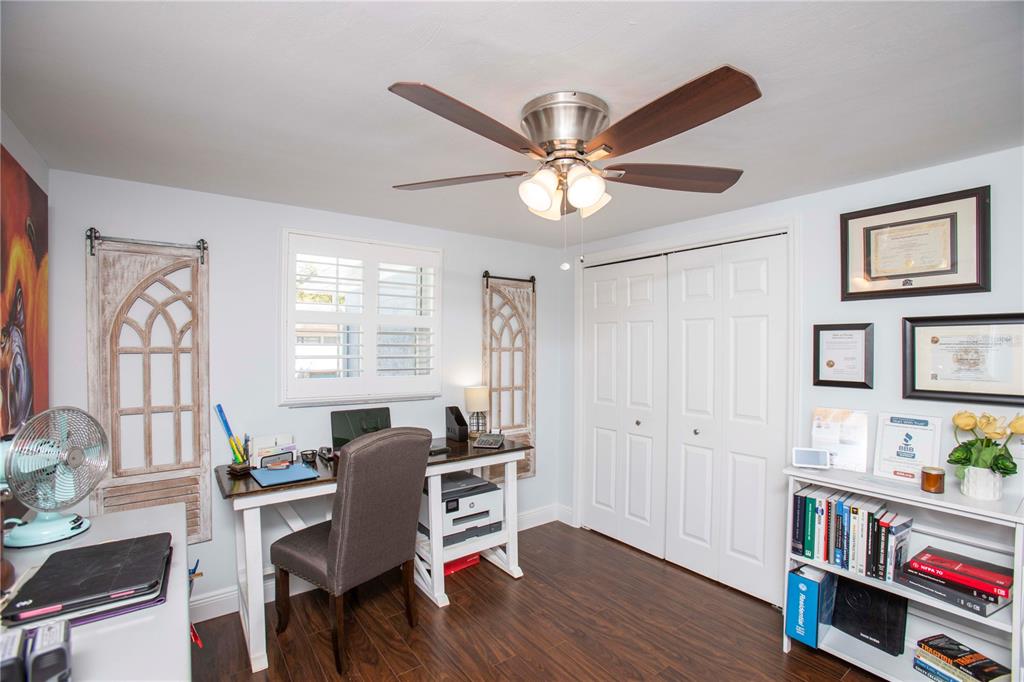 5240 School Road New Port Richey, FL 34653 - Photo 22 of 32 a view of a workspace with furniture and a window