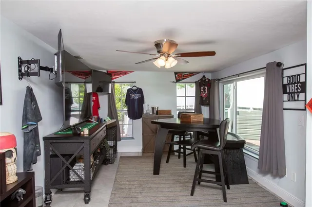 a view of a dining room with furniture window and outside view