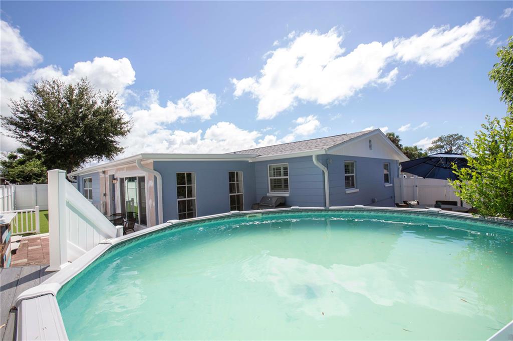 5240 School Road New Port Richey, FL 34653 - Photo 27 of 32 a front view of house with yard and green space
